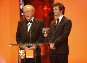 David Frost met his match on stage as he joined his film double Michael Sheen to present the Original Screenplay Award (BAFTA / Marc Hoberman).