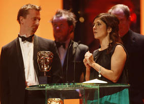 Stewart le Maréchal, Esther May Campbell and Zac Nicholson take to the stage to accept the Short Film BAFTA for September (BAFTA / Marc Hoberman).