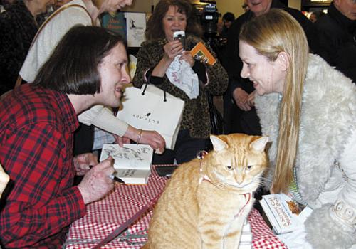 James signs A Street Cat Named Bob copies for fans