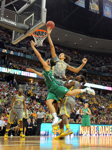 Brittney Griner (42) of the Baylor Bears blocks a shot attempt by Kayla McBride (23) of the Notre Dame Fighting Irish during the NCAA Women's Basketball Championship in Denver on Tuesday.