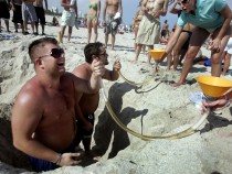 Party on the beach with a beer bong. (Photo by Joe Raedle/Getty Images)