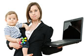 Woman holding baby and laptop