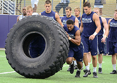 Penn State tight end Garry Gilliam helped heave a giant truck tire for the offensive team in the Penn State Lift for Life games, held July 13 at the University Park campus. The games are part of a national program, Uplifting Athletes, where student-athletes compete in tests of strength and endurance to raise funds for kidney cancer research.
