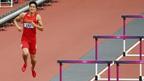 China's Liu Xiang hops down the track after crashing into the first hurdle and failing to finish his men's 110m hurdles heat at the London 2012 Olympic Games at the Olympic Stadium 7 August, 2012