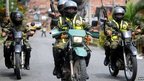 Troops on motorbikes patrol Medellin in photo from 19 June