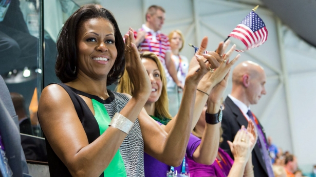 First Lady Michelle Obama watches the swimming finals at 2012 Summer Games