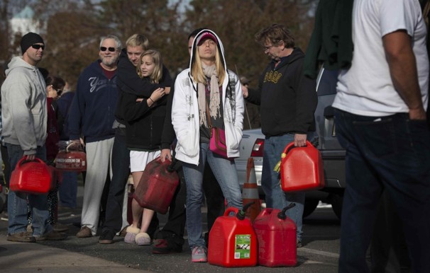 Rebecca Walsh waits in line for gas in Point Pleasant, N.J. Walsh said she had lost power and was temporarily living with friends.