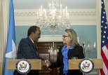 US Secretary of State Hillary Clinton shakes hands with Somalian President Hassan Sheikh Mohamud following meetings at the State Department in Washington, DC, on January 17, 2013