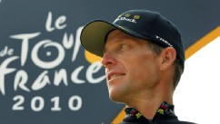 PHOTO:  Lance Armstrong looks back on the podium after the 20th and last stage of the Tour de France cycling race in Paris, July 25, 2010.