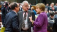 German Chancellor Angela Merkel, rigth, speaks with French President Francois Hollande, far left, at EU summit, Brussels,  Mar. 15, 2013.