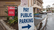 Hansen: City eyes downtown private parking