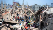 Collapse at factory building in Bangladesh kills nearly 100