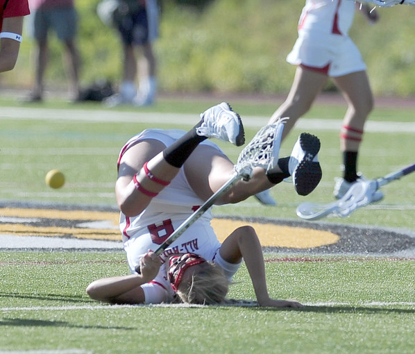 South team player Annie Anton, who is from Denveris upended in the first half. The North team won, 17-16.