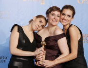 "Girls" creator and actress Lena Dunham (C) poses with cast members Allison Williams (R) and Zosia Mamet (L) after "Girls" won the award for Best Televison Series, Comedy or Musical at the 70th annual Golden Globe Awards in Beverly Hills, California Janua