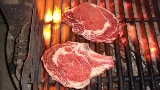 Steaks on barbecue grill