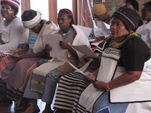 Community members receiving certificates for their home-based care training at a ceremony in the Eastern Cape.