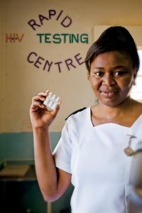A health worker displays antiretroviral (ARV) pills at a VCT centre