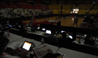 People use laptops during a blackout in the Poliedro stadium in Caracas, Venezuela