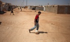 Syrian refugee boys play soccer at Zaatari Syrian refugee camp, in Mafraq, Jordan.