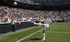 Gareth Bale kicks a ball to the fans during his presentation as a new Real Madrid player