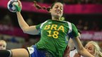 Brazil's left-back Eduarda Amorim jumps to shoot as she vies with a Norwegian player