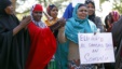 Somali women listen to a speaker at a solidarity rally to denounce al Shabaab&#39;s attack of a shopping mall in Nairobi, in Minneapolis, Minnesota, Sept. 27, 2013. 