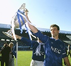 Everton central defender and captain Kevin Ratcliffe parades the Division 1 Championship trophy.