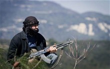 A member of the Free Syrian Army in the mountains west of Idlib, March 2012