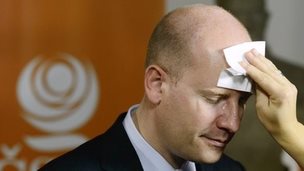 A make-up artist prepares Social Democrat leader Bohuslav Sobotka for a TV appearance as results come in
