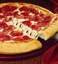 This handout photo provided by Pizza Hut,  shows a hand-tossed pizza.