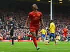 Raheem Sterling celebrates scoring in the victory over Arsenal for Liverpool