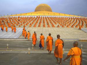17 February 2014: Buddhist monks arrive for prayers at the Wat Phra Dhammakaya temple in Pathum Thani province, north of Bangkok on Makha Bucha Day