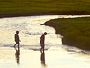 Picture of two children playing in a river, Yellowstone National Park, Wyoming