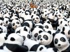 A model tiger is placed amongst paper pandas during an exhibition called 'Pandas on Tour' in front of the Presidential Palace in Taipei