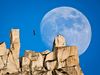 Picture of Dean Potter highlining against a full moon at Cathedral Peak in Yosemite National Park