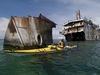 Photo: Kayaker paddles near shipwreck