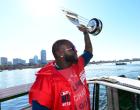 BOSTON, MA - NOVEMBER 2:  David Ortiz #34 of the Boston Red Sox holds up his World Series MVP trophy during a victory parade on November 2, 2013 through Boston, Massachusetts. (Photo by Michael Ivins/Boston Red Sox/Getty Images)