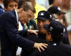 Baseball Commissioner Bud Selig talks with the umpires before the All-Star game was call at the end of the 11th inning with a tie score of 7-7 in Milwaukee, Tuesday, July 9, 2002. (AP Photo/Al Behrman)