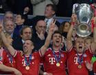 
	Bayern Munich's Dutch midfielder Arjen Robben lifts the trophy after the UEFA Champions League final football match between Borussia Dortmund and Bayern Munich at Wembley Stadium in London on May 25, 2013, Bayern Munich won the game 2-1 AFP PHOTO / CHRISTOF STACHECHRISTOF STACHE/AFP/Getty Images

