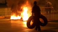 Lebanon roads reopen after tense protests, clashes over Syria