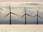 Turbines of the Burbo Bank off shore wind farm adorn the skyline in the mouth of the River Mersey