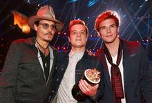 Johnny Depp awards Josh Hutcherson for Best Male Performance for his role in the Hunger Games