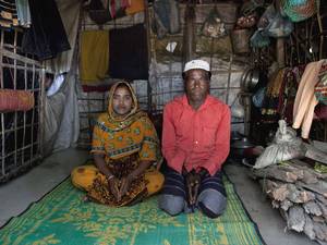Hamid and his daughter Rajama sit inside their home in the Shamalapur Rohingya refugee settlement in Chittagong district. They fled to Bangladesh from the Dhuachopara village in the Rachidhong district of Myanmar