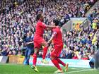 Raheem Sterling and Luis Suarez celebrate during Liverpool's game with Norwich