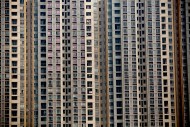 A residential apartment building stands in the Haizhu district of Guangzhou, Guangdong Province, China, on Nov. 23, 2013