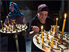 Picture of women cleaning wax off candle trays in the Sioni Cathedral in Georgia