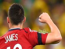 Colombia star James Rodriguez celebrates but is unaware that a grasshopper is on his arm