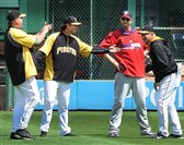  Before the Phillies-Pirates series opener Friday at PNC Park,  A.J. Burnett was able to catch up with, from left, Jim Benedict, Jeff Locke and pitching coach Ray Searage.