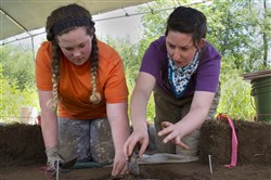  Clarion University students Gabriella Oglietti, left, and Hannah Biddle excavate a site near West Hickory Wednesday. 