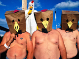 Photo of shirtless men with paper bags over their heads